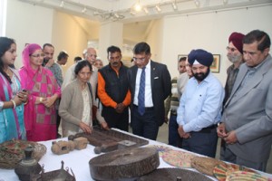 Shalendra Kumar having a look on antifacts displayed at Kala Kendra on Wednesday.