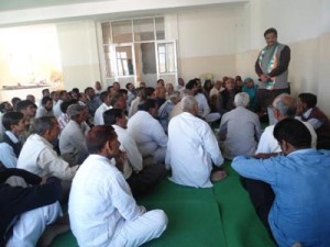 Former Minister and senior Cong leader G S Charak addressing workers’ meeting at Bishnah on Wednesday. 