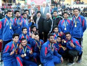 Jubilant winners of North Zone Handball Championship posing along with the dignitaries in Jammu on Thursday. -Excelsior/Rakesh