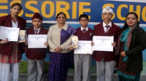 Third place winners of quiz competition posing for a photograph.