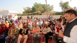 Ex-MP Madan Lal Sharma addressing election rally at Nagrota on Sunday.