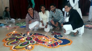 Students making rangoli during competition organised by NSS unit of Government Degree College, Kathua on Monday.