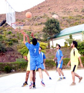 Players in action during a basketball match at BGSBU in Rajouri. 