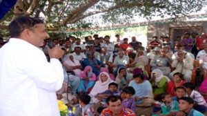 Minister for PHE, Sham Lal Sharma addressing public meeting in Akhnoor on Saturday.