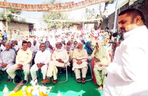 Senior Congress leader and former MP, Madan Lal Sharma, addressing a public meeting in Akhnoor constituency.