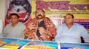 Pandit Rumil Singh interacting with media persons at Jammu on Friday.