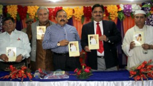 Union Minister, Dr Jitendra Singh along with other dignitaries releasing Girja Pandit’s book at Jammu on Monday.