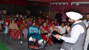 Surinder Singh Shingari addressing public gathering in Jammu West constituency.