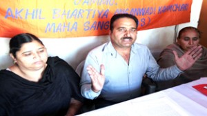 Leaders of AWWA and Bhartiya Mazdoor Sangh addressing a press conference at Jammu on Sunday.