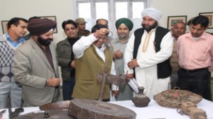 Divisional Commissioner, Jammu, Shantmanu, having a glance over heritage items depicted in heritage exhibition at Kala Kendra, Jammu.