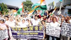 PoJK refugees raising slogans during protest at Jammu on Wednesday. -Excelsior/Rakesh