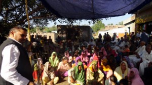 Ex-MP Madan Lal Sharma addressing public meeting in Akhnoor. 