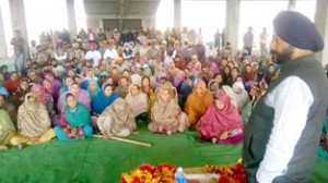 Congress candidate Manjit Singh addressing election rally in Vijaypur on Tuesday.