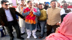 Kavinder Gupta during campaigning in Gandhi Nagar on Tuesday.