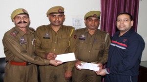 GRP constables posing for photograph after being awarded by SP Railways Suram Singh for their act of honesty. 