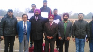 Winners posing along with chief guest and other dignitaries at BSF School Paloura in Jammu.