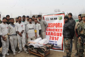 Army officials and cricketers of Lasipora posing along with cricket kits at Lasipora.