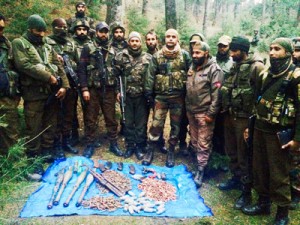 Army and police display arms and ammunition recovered at Rainawari forest of Handwara on Tuesday. -Excelsior/Aabid Nabi