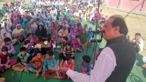 NC candidate for Vijaypur constituency Surjeet Singh Slathia addressing a public meeting at Gudwal in Vijaypur. 