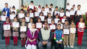 Students of Banyan International School who excelled in Wushu Championship posing for a group photograph.