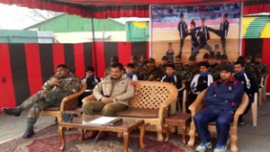 Army personnel and officers of District Administration Bandipora before flagging off Kick-Boxing players. 