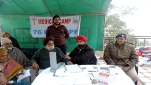 Doctor examining patient during free medical camp on Saturday.