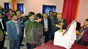 H R Pakhroo lighting ceremonial lamp at the inaugural of State level project presentation of NCSC on Thursday.