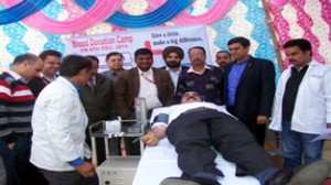 A volunteer donating blood during blood donation camp on Thursday.