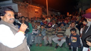 Minister for Housing Raman Bhalla addressing election rally in Gandhi Nagar constituency.