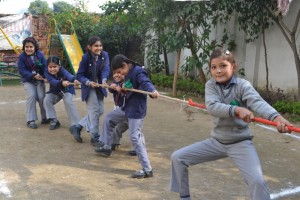 Students displaying their strength in Rope pulling competition during Annual Sports Week at Minerva School of Learning, Akalpur.