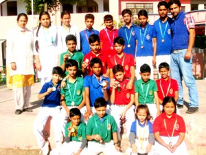 Medal winners of Playway School Pounichak posing  for a group photograph. 