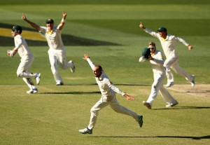 Nathan Lyon sets off in celebration after sealing Australia's win in  Adelaide on Saturday.