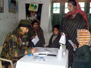 Doctor examining a patient during free medical checkup camp on Friday.