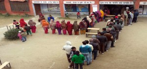 Electorates line up to caste their vote at a polling station in Government Higher Secondary School, Arnia on Saturday.  -Excelsior/Rakesh