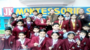 Medal winners of JK Montessorie School posing for a group photograph.