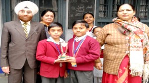 Kavish Jain and Tushar Sharma of SM Jain Higher Secondary School, Jammu, posing with Gitokukai Kofukan Karate Trophy won by school.