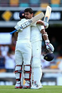 Murali Vijay of India celebrates century with team mate Ajinkya Rahane during day one of the 2nd Test match between Australia and India at The Gabba on Thursday. 