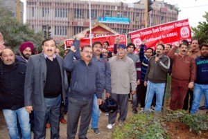 Bank employees staging protest at Shalamar Chowk in Jammu on Tuesday.