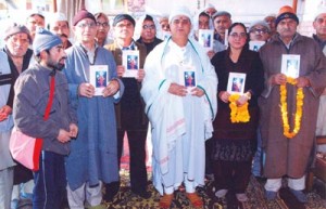 Swami Kumar Ji releasing a religious book in his Ashram premises on Monday.