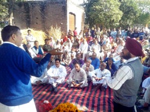 Sham Lal Sharma addressing a public meeting at Maira in Akhnoor constituency on Friday.