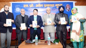 Divisional Commissioner Jammu, Shantmanu and others releasing special issue of Sheeraza on Tuesday.