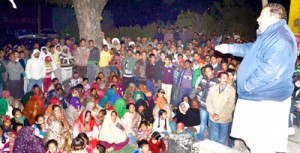 National Conference candidate Devender Singh Rana addressing election meeting at Jandrah.
