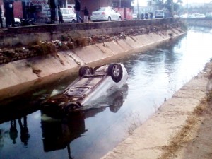 An ill fated car that plunged in a canal at Trikuta Nagar on Tuesday.