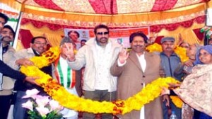 Minister for Housing Raman Bhalla and Bollywood star Mukesh Rishi during election campaign at Jammu on Thursday.