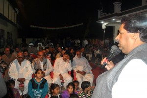 Raman Bhalla addressing a public meeting in Gandhi Nagar constituency on Saturday.