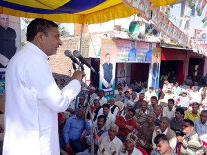 Cong candidate Sham Lal Sharma addressing public meeting in Akhnoor on Monday.