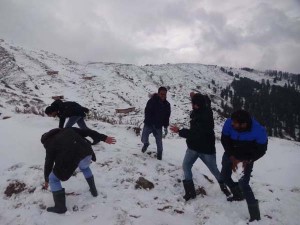 Tourists enjoying snowfall at Nathatop near Patnitop on Wednesday.(Another pic on page 10)  -Excelsior/ Vasu Gupta