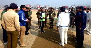 Captains of participating teams in BPL tossing coin before start of match at Sher-i-Kashmir Stadium, Bandipora on Monday. -Excelsior/Aabid Nabi