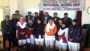 Winners of essay writing competition posing for a group photograph at GDC Mendhar. 