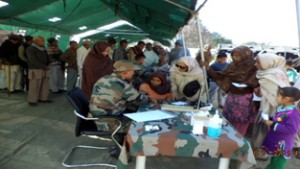 Doctors examining patients during medical camp organized by Army in Akhnoor on Saturday.